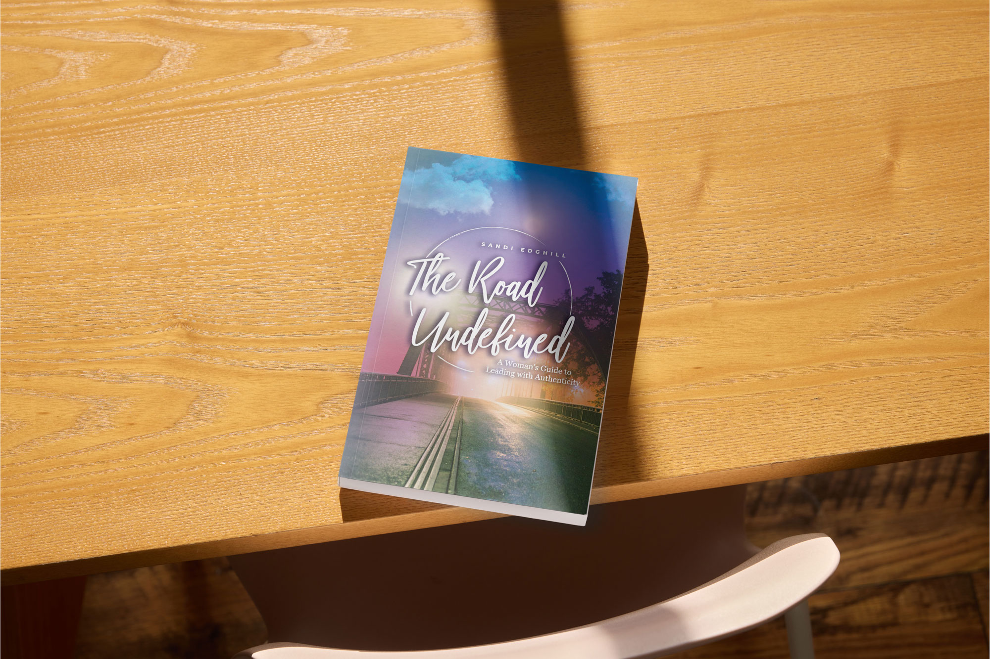 book on wood table with bright colorful cover